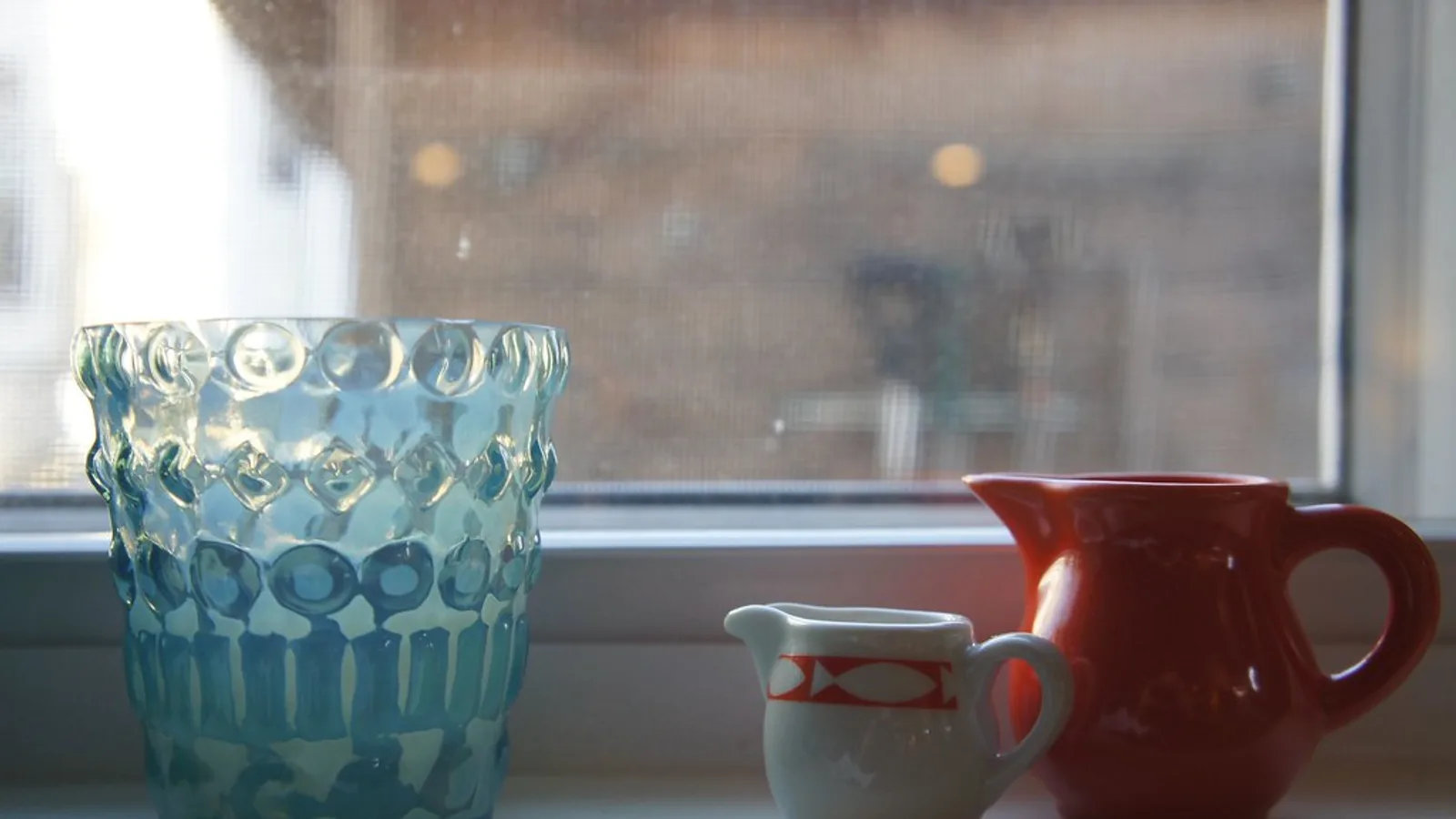 Stoneware mugs and linen napkins on a windowsill, the 40-SKU store testing AI tools for ecommerce